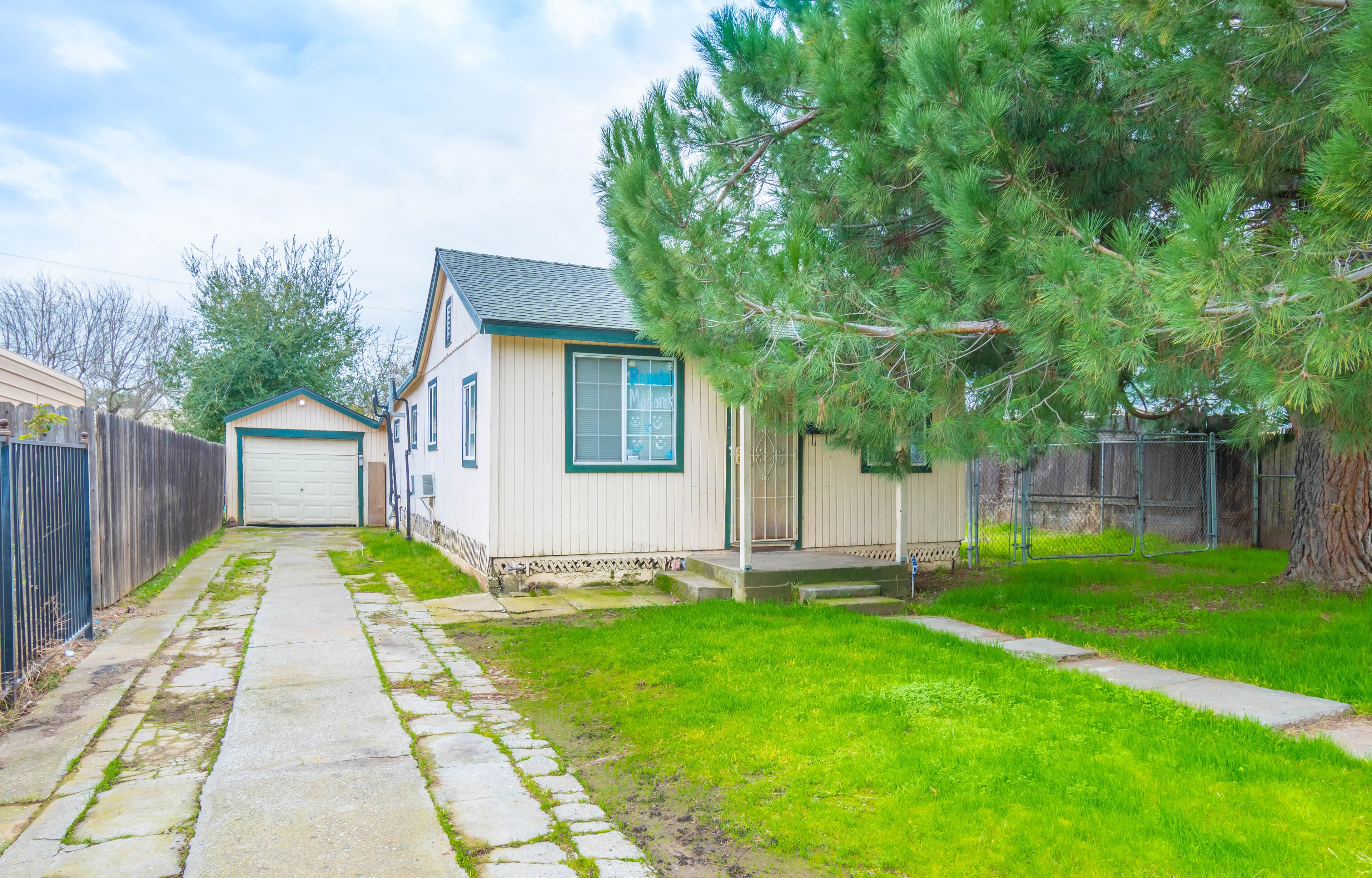 Exterior of home we purchased for cash in Orange Cove CA